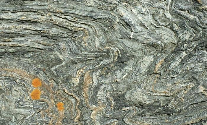 This rock was originally soft mud which underwent extreme compression turning it into green schist - named New Harbour from the locallity where it was